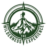 The Wilderness Experience logo